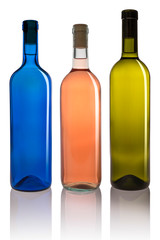 Set of three different colored bottles on white background