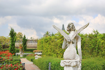A beautiful angel statue in the garden.