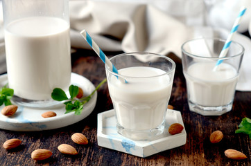 Almond milk on a dark wooden table