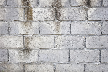 Abstract weathered textured grey brick wall background
