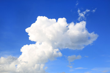 Naklejka na ściany i meble Blue sky background with puffy clouds.
