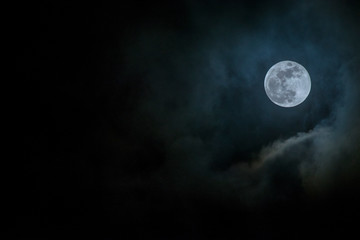 Naklejka na ściany i meble Full Moon Shining through a Gap in the Clouds