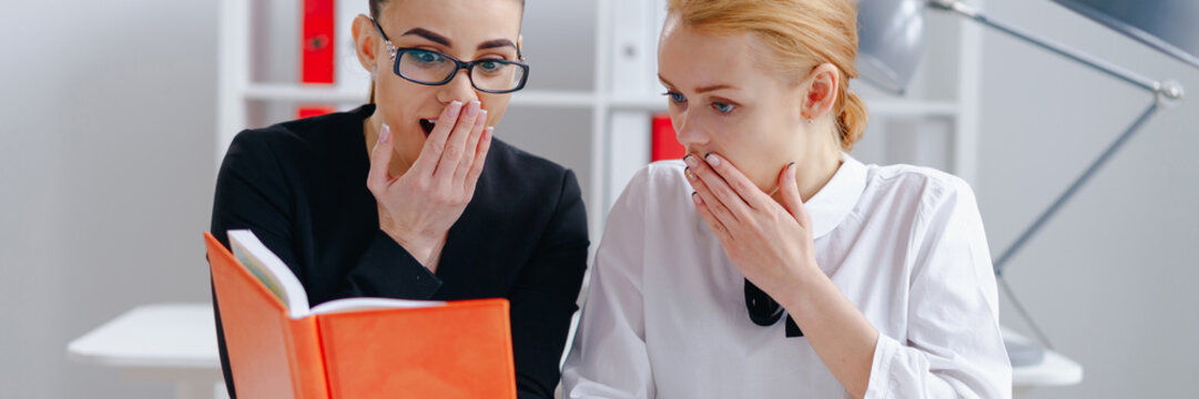 Surprised attractive colleagues