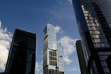Fototapeta na wymiar Skyscrapers in the city. tall house. Metal and steel.