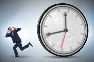 Businessman employee in time management concept