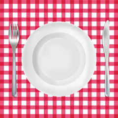 Red checkered tablecloth with realistic plate, knife and fork