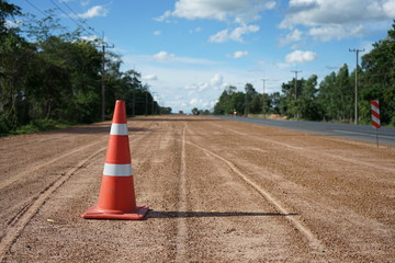 Red rubber cone is placed on the road during the construction of the road in thailand