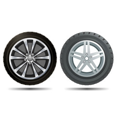 Obraz premium Two different car wheels on a white background