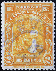Harvesting cocoa pods on ancient stamp of Costa Rica