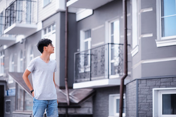 Asian fashion man outdoors in the city