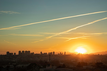 Sun rising in a scribbled sky