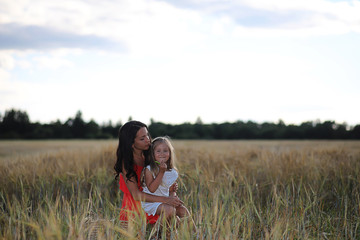Summer landscape and a girl on nature walk in the countryside.