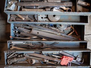 metal box with old tools and wrenches