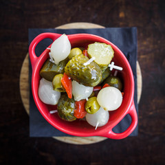 spanish banderillas, skewers with pickling olives, garlic, pickles, onion and red pepper