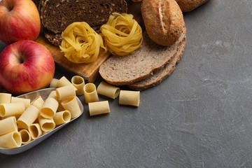 Close up of food with healthy carbohydrates on gray