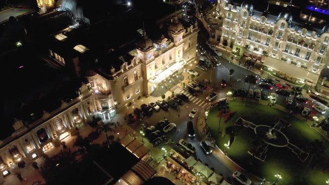 Monaco city town Monte Carlo Drone 4K flight via casino and sea yacht port night and evening time