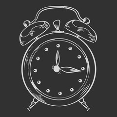 Alarm clock drawn in chalk on a gray board background