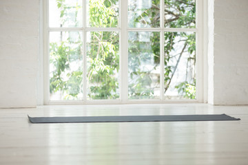 Obraz na płótnie Canvas Light studio yoga class room picturesque view seen from window