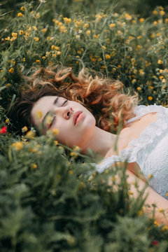 Young girl in harmony in the summer nature