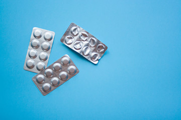 Some medical blisters with pills top view. Medical concept of treatment diseases, sale of tablets, tablets in blister packs.