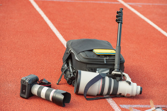 Fototapeta Proffesional sport photo equipment, digital camera and telephoto lens