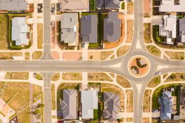 Aerial view of streets, rooftops and a roundabout embellished with landscaping design in the newly...