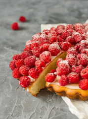 Raspberry cake on gray background