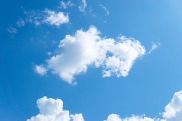 Naklejka na ściany i meble Large fluffy clouds in the blue sky.