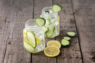 Fresh Cold Water with Lemon and Cucumber Infused Water Healthy Detox Water with Lemon and Cucumber Wooden Background Horizontal Copy Space