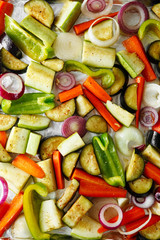 Roasted vegetables mix on baking tray, food above. Vegan food