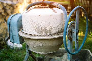 cement mixer in construction area. Old cement mixer