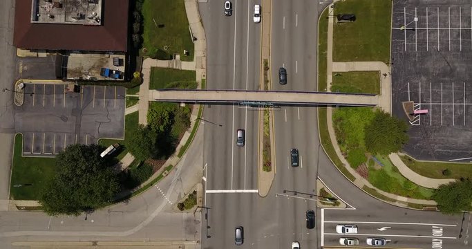 Drone straight down over heavy highway overpass traffic