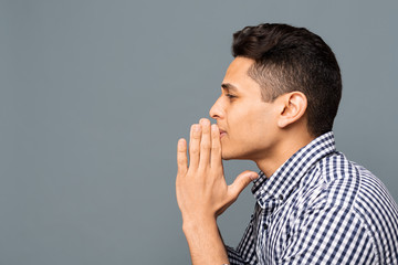 Young Man Praying And Asking For Something, Side View