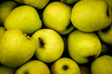 Green apple on the shop counter.