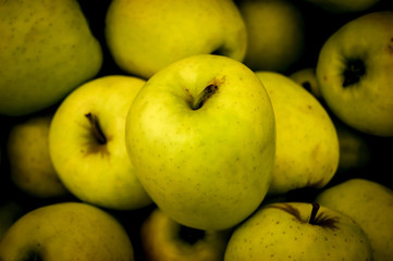 Green apple on the shop counter.