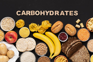 Healthy food with carbohydrates on black background