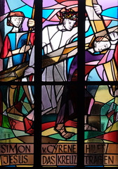 5th Stations of the Cross, Simon of Cyrene carries the cross, stained glass window in Saint Lawrence church in Kleinostheim, Germany 