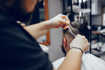 Obraz na płótnie Canvas Hairdresser with a client. Man with a beard. Guy in a barbershop
