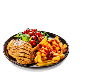 Grilled chicken fillet with french fries on white background