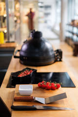 Preparing utensils and vegetables for a grilling