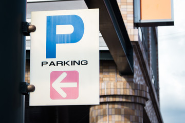 Close up of parking sign with pole.