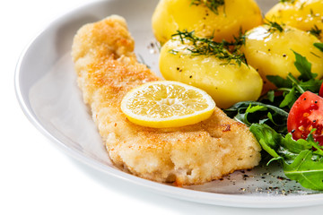 Fried fish with potatoes on white background