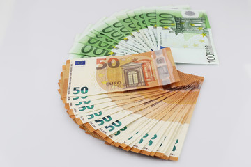 100 and 50 euro bills euro banknotes money. European Union Currency.  Isolated background.