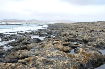 Fototapeta na wymiar Rocky Volcanic Beach on the Northwest of Fuerteventura, Canary Islands