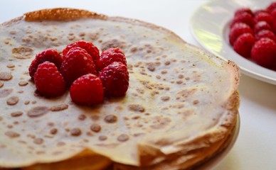 pancakes with berries. Pancakes with raspberries isolated on a white background 