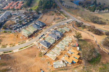 Aerial view of housing development and construction in a newly established suburb in the area of Ginninderry in Canberra, Australia