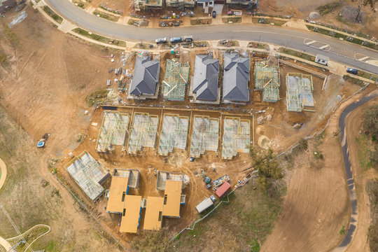 Aerial view of housing development and construction in a newly established suburb in the area of Ginninderry in Canberra, Australia