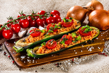 Stuffed zucchini with groats and vegetables