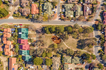 Aerial view of streets and rooftops in the suburb of Holt in Canberra, Australia