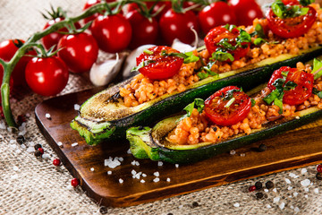Stuffed zucchini with groats and vegetables